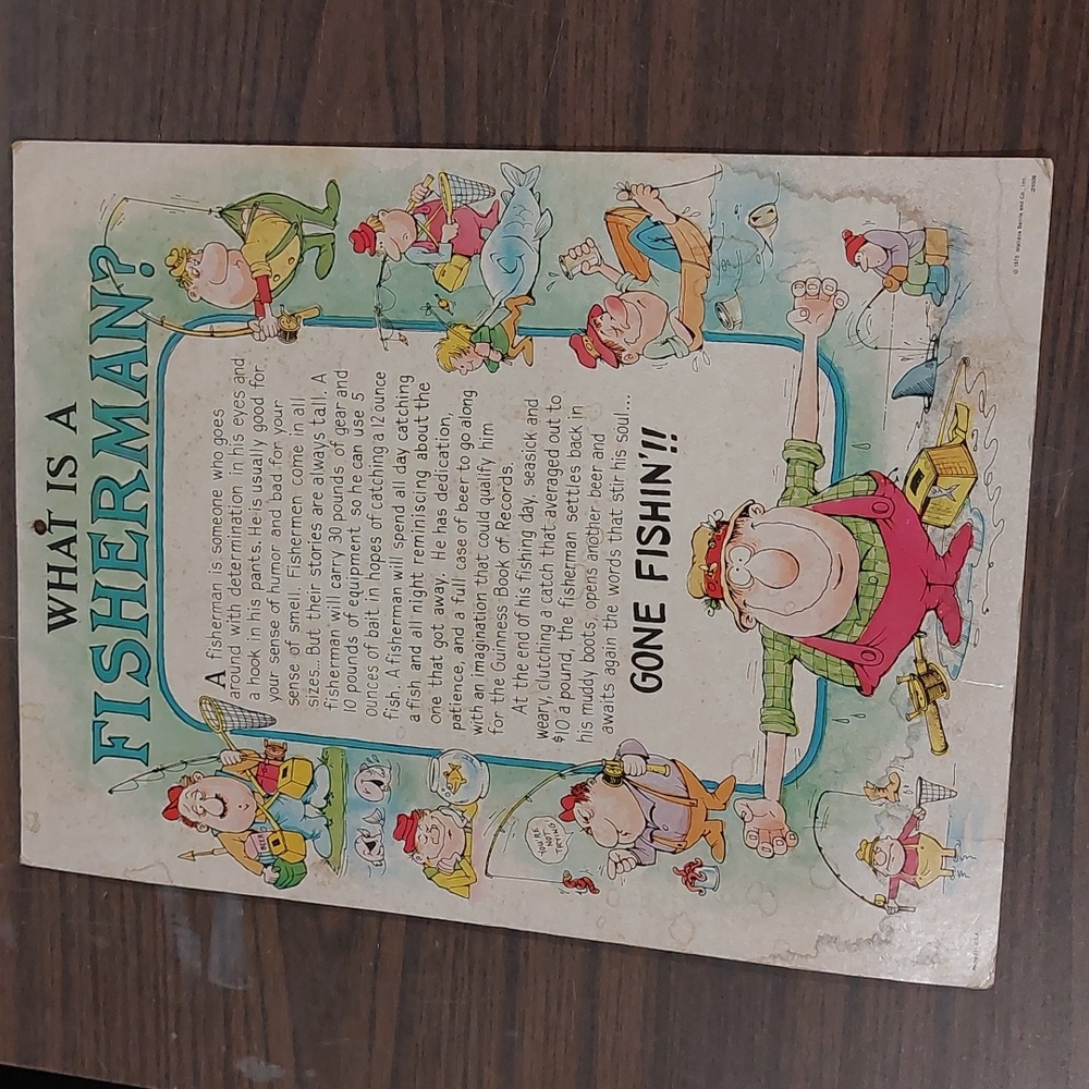 Humorous cardboard poster "What is a Fisherman?"